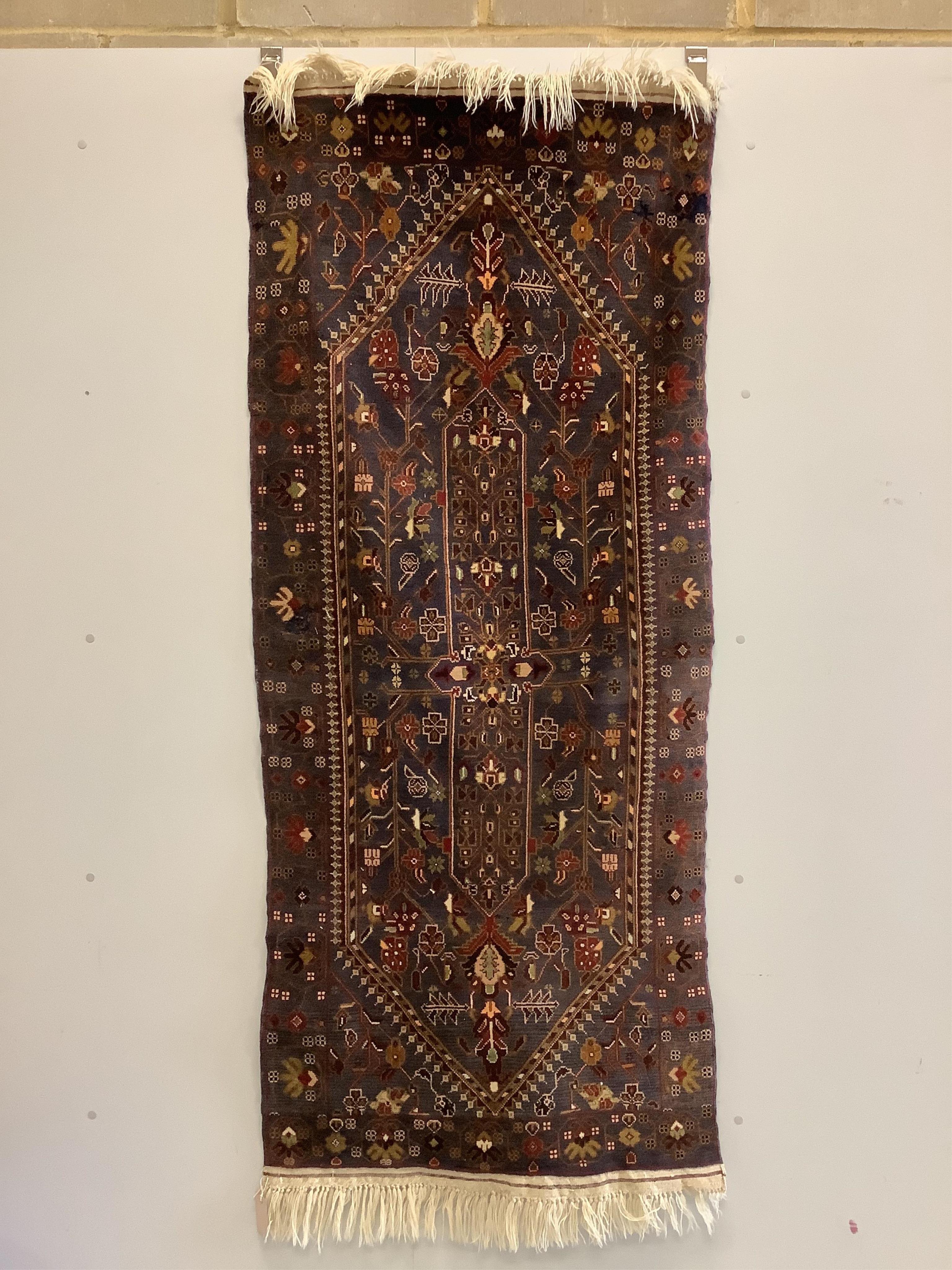 A North West Persian blue ground rug, 194 x 84cm. Condition - fair to good